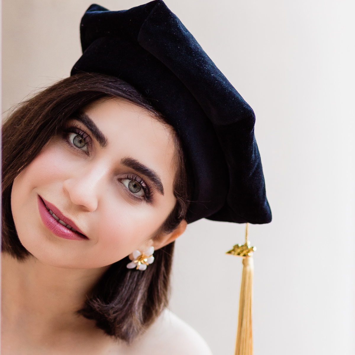Mahada wearing a graduation cap 
