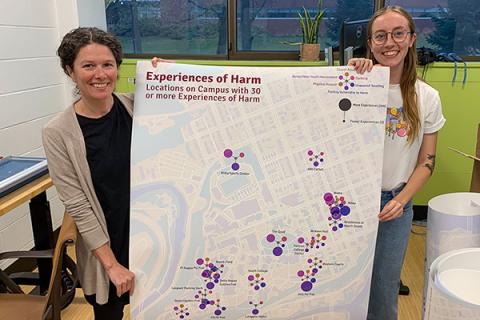 Dana Cuomo and Lily Houtman display a city map, part of their Harm Mapping Project to visualize gender-based violence on campus at Lafayette College.