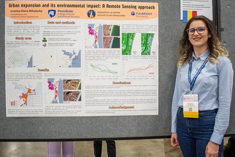 Cristina presents her research poster at the AAG Conference