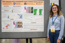 Cristina presents her research poster at the AAG Conference