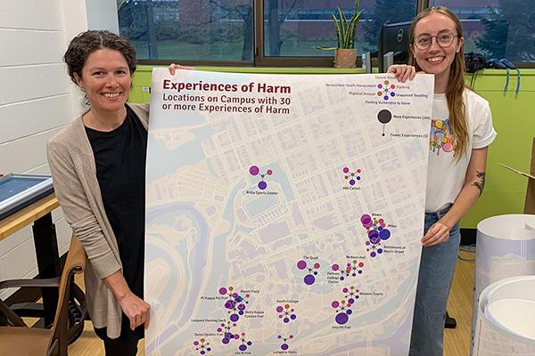 Dana Cuomo and Lily Houtman display a city map, part of their Harm Mapping Project to visualize gender-based violence on campus at Lafayette College.